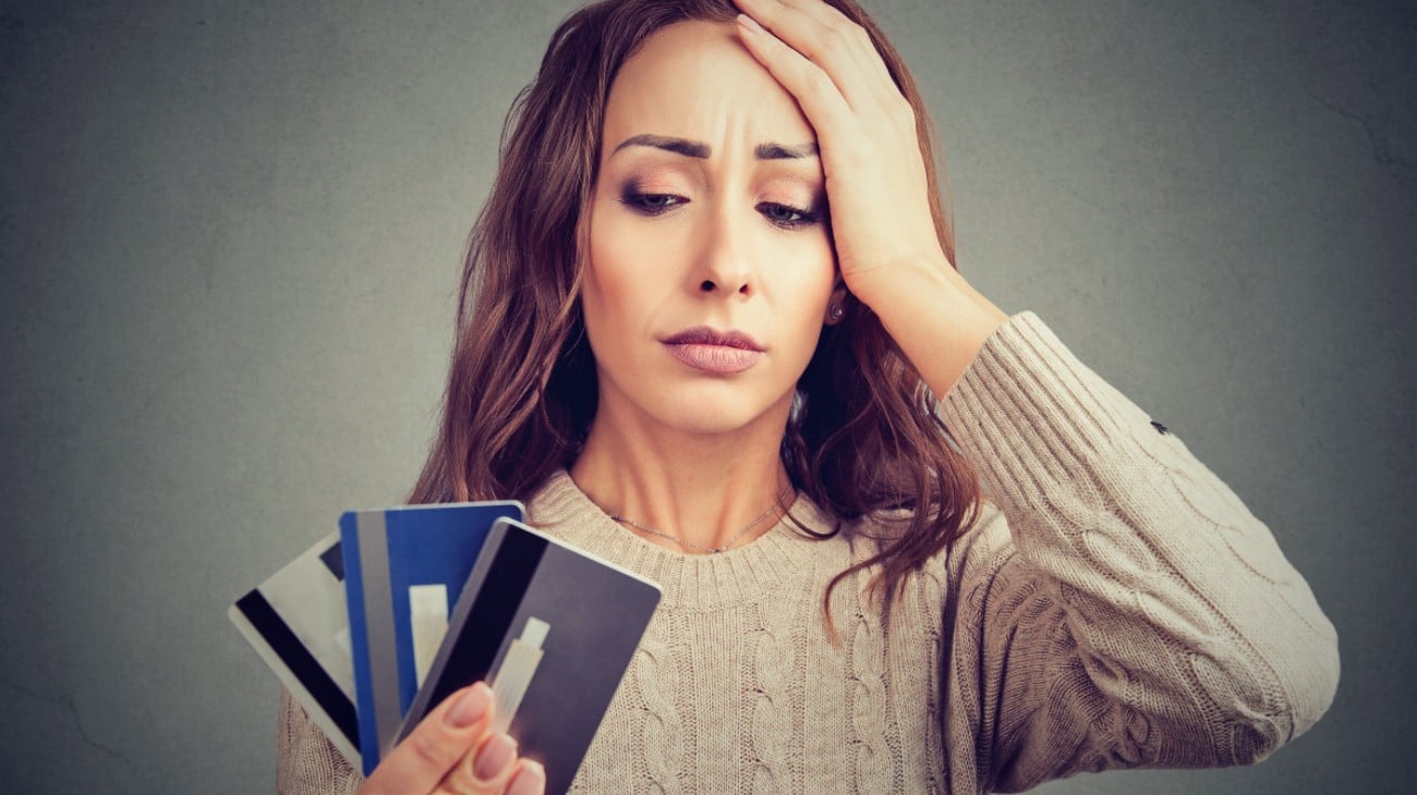 Balancing Debt and Charitable Giving | Woman Stressing About Credit Cards
