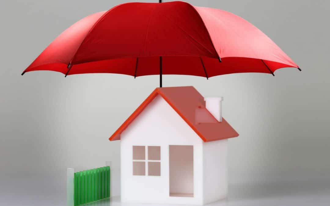 How Insurance reinforces your financial legacy | Red umbrella covering a house