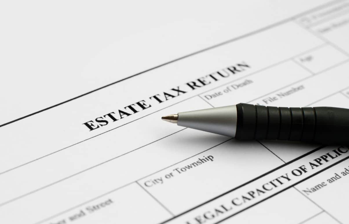 Minimizing Exposure to the Estate Tax | Pen resting on an estate tax return